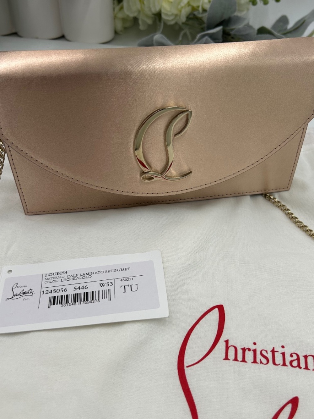 Christian Louboutin Loubi 54 Clutch in gold crepe satin. Made in Italy.